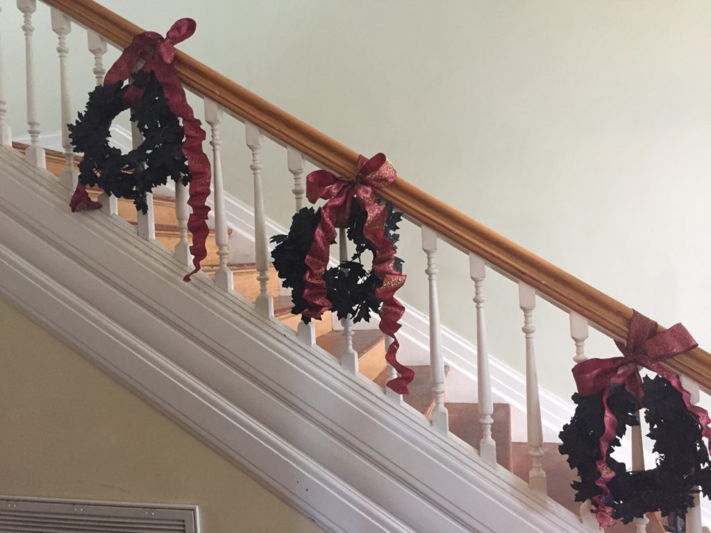 Hang some simple, glittery, wreaths by thick ribbon along your staircase. - IMG_5278